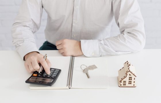 unrecognizable-realtor-counting-office