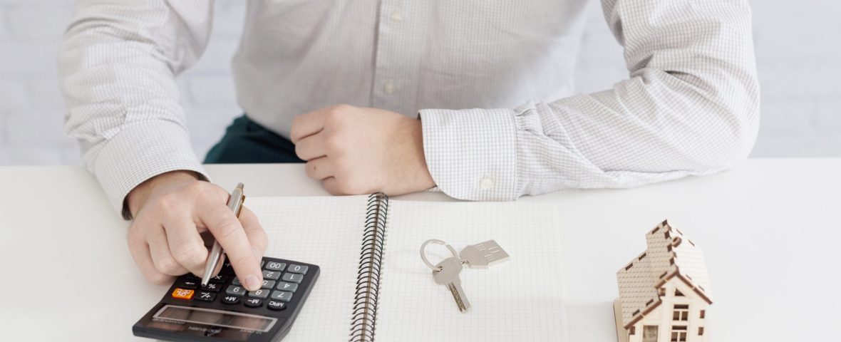 unrecognizable-realtor-counting-office